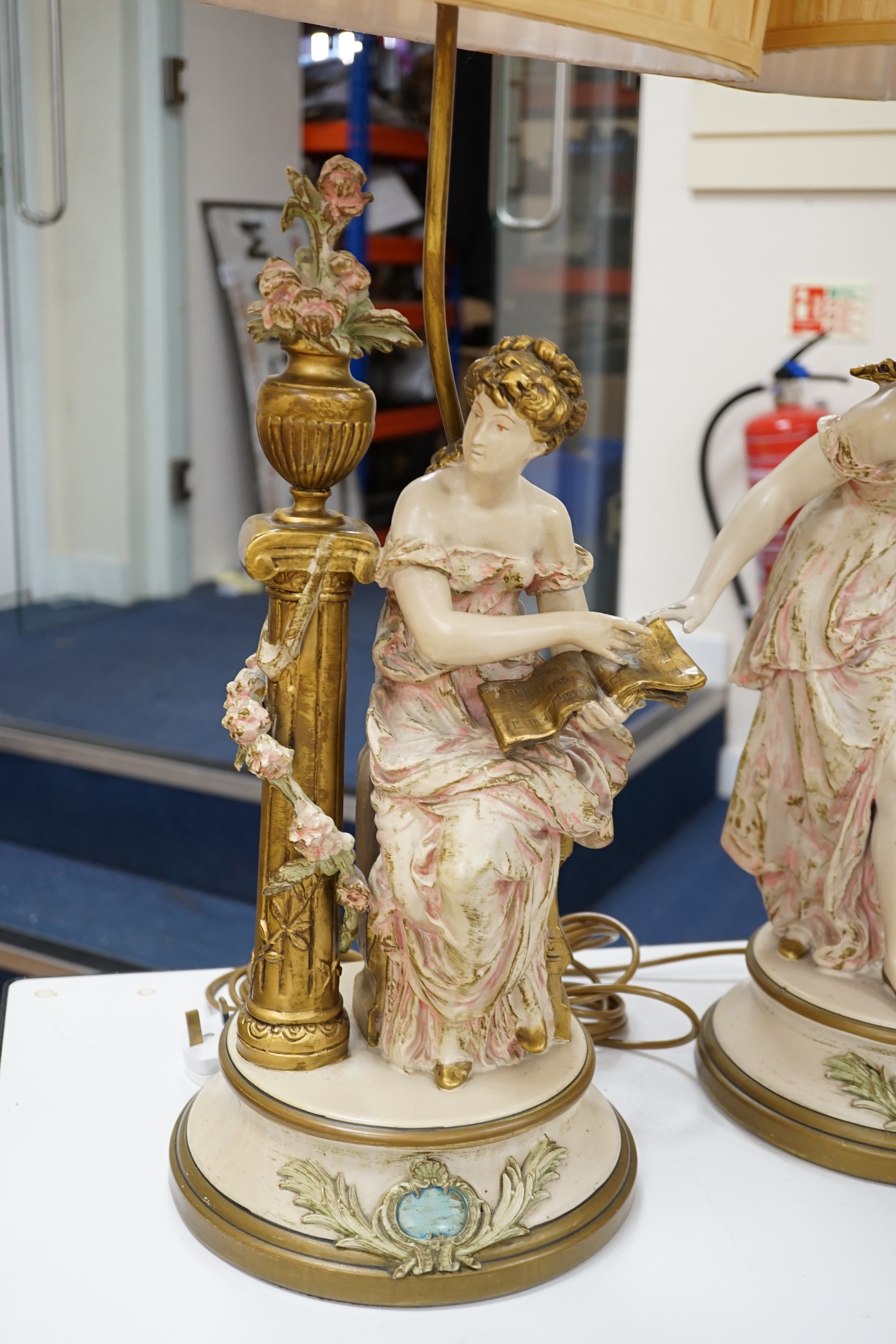 A pair of painted spelter figural table lamps, 82cm high including light fitting and shade